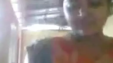 Aroused Indian shoves fingers into pussy and demonstrates her boobs