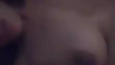 Young gal in red lingerie teases her XXX Desi pussy for the camera