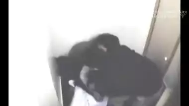 Sexy dark skin Indian girl hiking her blouse to...